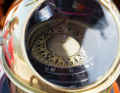 The compass with its diamond-shaped graduations sits in a brass housing