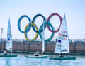 The five rings in the harbour of Qingdao bear witness to the Olympic past.