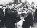 The Danish top sailor Paul Elvstrøm presents one of the first Opti sailors in Europe with the regatta prize in 1959