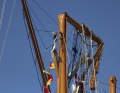 Rigging parts are hanging from one of the broken masts.