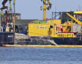 The salvage site resembles a floating building site.