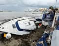 Birżebbuġa, Malta: A badly damaged yacht is washed ashore after Storm Harry caused severe devastation on the island.