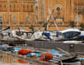 Marsaskala, Malta: Yachts overturned by strong winds and waves lie in a boatyard after the area was badly hit by Storm Harry.