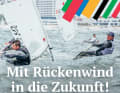 Eine Plakatwerbung für olympisches Segeln in Rostock-Warnemünde.