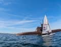Während der Kieler Woche fuhr ein aufgetauchtes U-Boot auf dem Weg von Eckernförde nach Kiel durch die auf Wind wartenden Ilcas. Die Szene wurde von einem der Segler gefilmt und ging anschließend viral.
