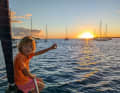 A new day in the Caribbean. Nine-year-old Lotta watches the sunrise in a good mood