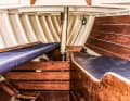 The forepeak contains the chain locker, a sea berth and a pipe berth, with a forecastle underneath. The interior and layout date from the year of construction