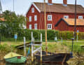 Small classic boats are moored at the jetty in Pataholm