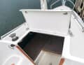 The companionway is closed by a hinged hatch
