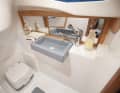 This is quite spacious. The toilet is located under the cockpit recess and does not offer too much headroom
