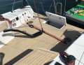 Division of labour. The tiller, which ends far forward, positions the rudder well away from the traveller and backstay