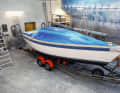 The deck, which is not to be painted until the end, is masked off. The underwater hull is also protected