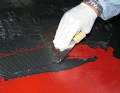 4. the adhesive from the accessories is applied to the deck and spread with the notched trowel