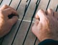 2. use the blade of a cutter knife to cut the protruding sealing compound flush to the height of the teak rods