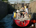 The "Aracanga" in one of countless canal locks. The crew takes the lines out of their hands