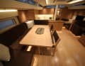 The guests dine on the port side, and there is a small dinette on the starboard side in front of the main bulkhead