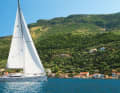 A yacht sails in the light afternoon breeze near Kioni on Ithaca. The area is characterised by thermals and there is often a calm in the mornings and evenings - ideal for nights at anchor