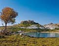 Dense greenery. Lindos on the south side of Rhodes. The Dodecanese offers more vegetation than the Cyclades