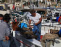 Fishermen sell their catch directly from the boat