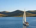 Yacht sails between the islands off Murter