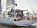 The wheels are positioned correctly for a good forward view; the helmsman looks over the roof or sideways past it