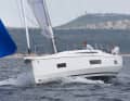 The chine edges, which extend all the way to the stem, provide more volume below deck and noticeably greater dimensional stability under sail