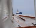 A freighter in front of the bow, on its way to the Kiel lighthouse