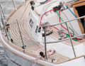 The foresail is sheeted on the superstructure and is equipped with barber haulers for sheeted courses