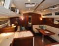 Below deck, the combination of mahogany wood, light-coloured upholstery and wide white surfaces makes it bright, comfortable and extremely homely. You immediately feel at home.
