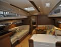 The saloon. Galley on the right, navigation and WC on the left.