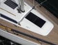 Two flush hatches provide light below deck, with the rear skylight already in the saloon. The self-tacking rail is moulded in