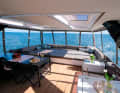 The roof terrace offers space for dining and relaxing and a view over the harbour pier