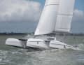 The rather voluminous wave piercer hulls with a flat frame come through the waves surprisingly well