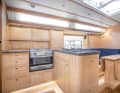 Galley and lounge in light oak