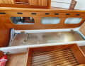 Arcona 385 The stainless steel diesel tank is embedded under the sofa berth, fresh water is stored on the opposite side