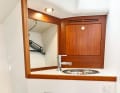 Arcona 385 The washbasin is very small. But there is an open oilskin locker