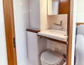 First 36 Very small and simple bathroom. The washbasin can be folded up