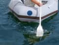 The blade is positioned so that it pushes the water aft