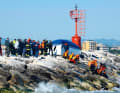 Instead of the safe harbour of Rimini, this yacht's trip ended on the stone pier