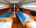 Asymmetrical: lockers to starboard, aft to port - in the shipyard's brochure it's the other way round. The benches are long and wide enough to accommodate extra crew during regattas
