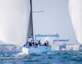On day one of the Kieler Woche, light wind sailing in front of a typical Kiel backdrop was in demand.