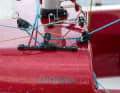The jib sheet is double-sheeted.  There are no winches on board