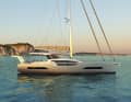 Unusual design. The hull is cut out in the middle, creating maximum transparency through the large superstructure windows. This is made possible by the recessed side decks.