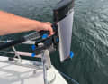 The lightweight motor can be carried into the dinghy with one hand.