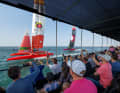 Spaniards and Swiss race past the spectators at the Dubai Sail Grand Prix.