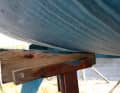Wedges can come loose when the structure moves. It is better to secure them to the support
