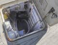 This small service room is located in the foredeck, water is still on the floor and will be pumped out soon. It is not yet known whether the hatch was open when the storm hit.