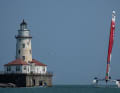 The Canada SailGP team with helmsman Phil Robertson passes the lighthouse in Chicago harbour