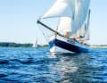 In light winds, the heavy "Belle Amie" is pushed by full sail: flyer, jib, jib, main, mizzen and two topsails