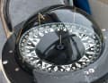 The compass symbolises a time when navigators were regarded as demigods and weather routing was considered black magic